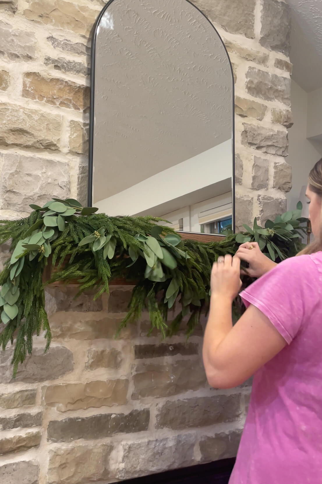 Mixing eucalyptus garland with pine garland on my fireplace mantel.